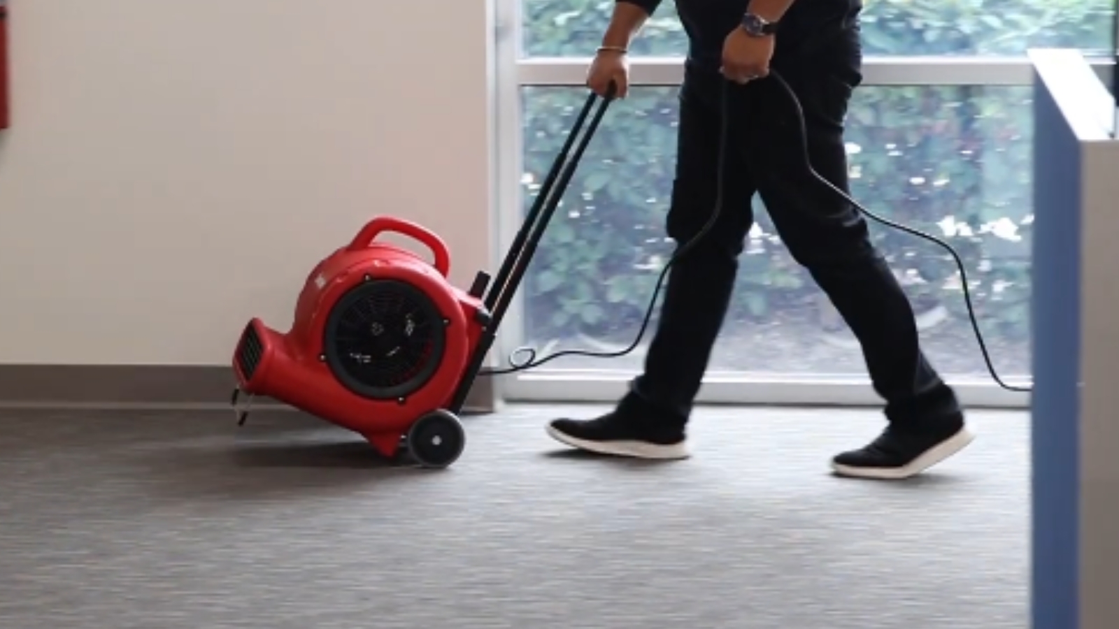 Water damage restoration equipment set up in a room
