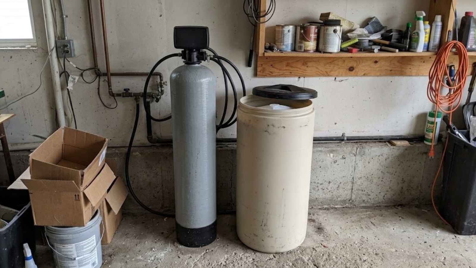 Water softener system in a garage utility area